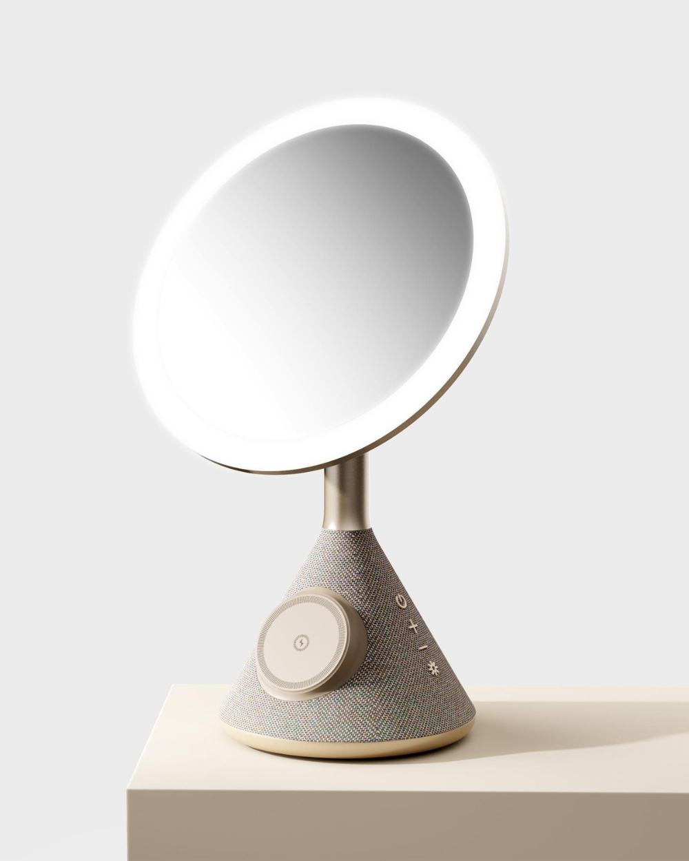vanity mirror with magsafe charging sat on the ledge facing outwards. gold version