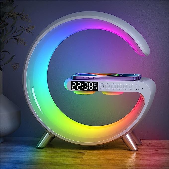 UK Technology G Shaped LED Lamp + Alarm Clock front view on rainbow colour mode on top of a desk