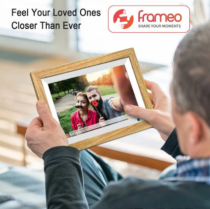 UK Technology Oak Wood Digital Photo Frame being used by someone which shows it is easy to use