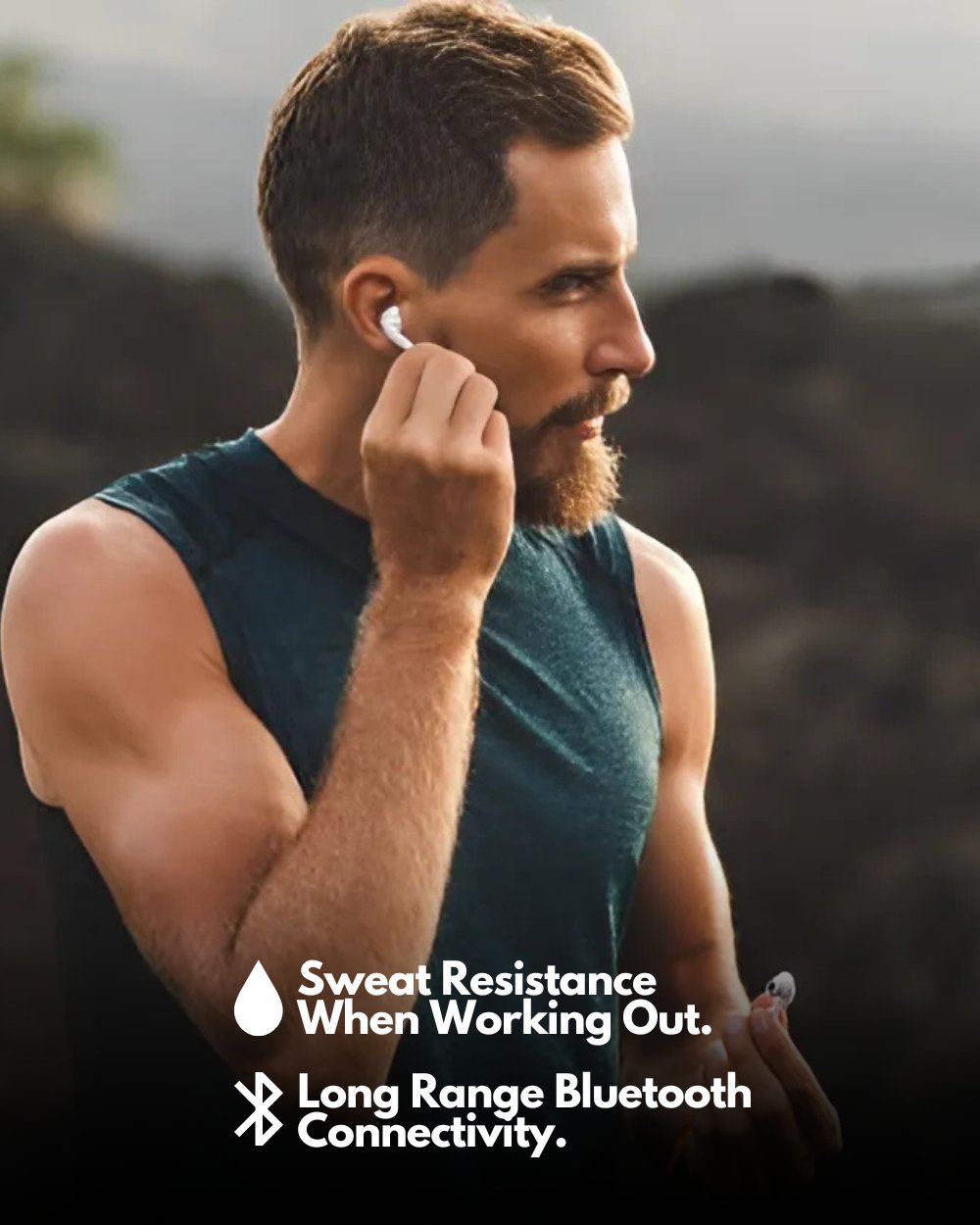 person jogging whilst wearing the earphones highlighting that they are sweat resistant and have long range bluetooth connectivity